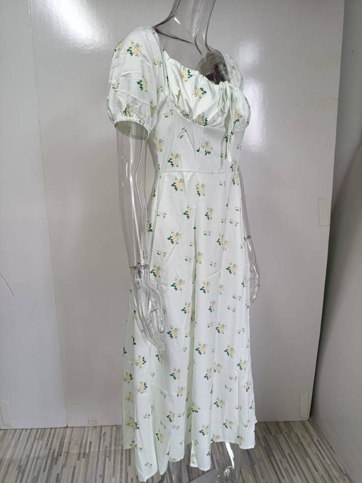 A white floral print midi dress featuring puffed short sleeves and a square neckline ideal for elegant daytime occasions.