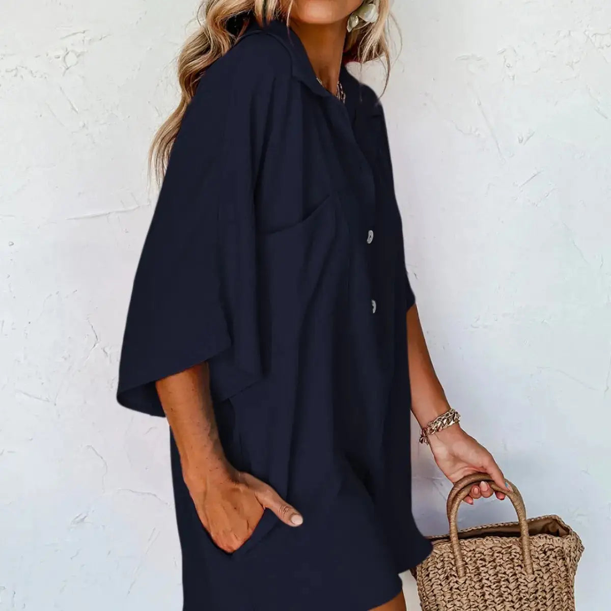 Navy blue oversized button-down summer jumpsuit with short sleeves and side pockets designed for casual wear.