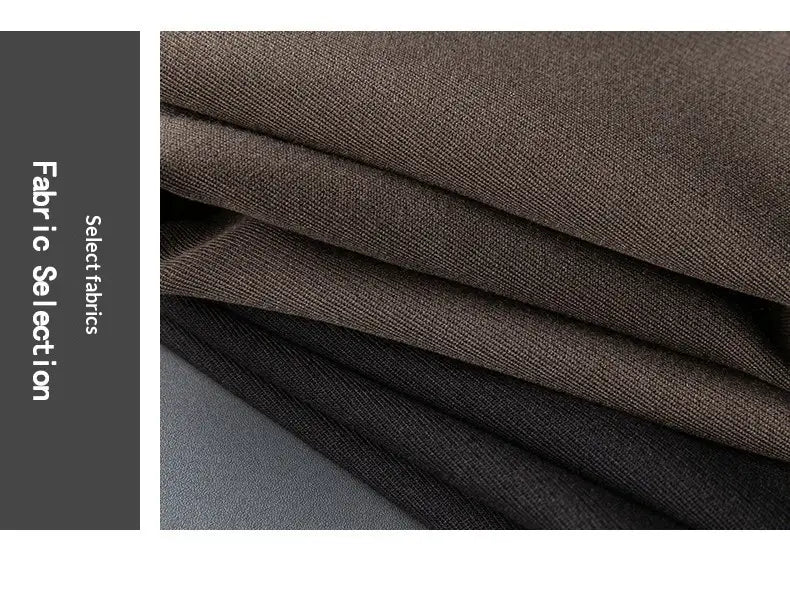 Stack of dark brown and black woven fabrics with a subtle textured weave for men’s slim fit British style tailored straight leg trousers.