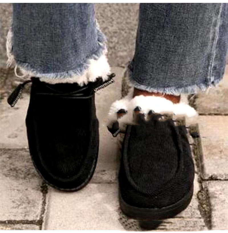 Schwarze Wildleder-Mokassin-Slipper mit weißem Kunstfellfutter und Reißverschlussverschlüssen, entworfen als warme Baumwoll-Flachschuhe mit Corduroy-Loafern.