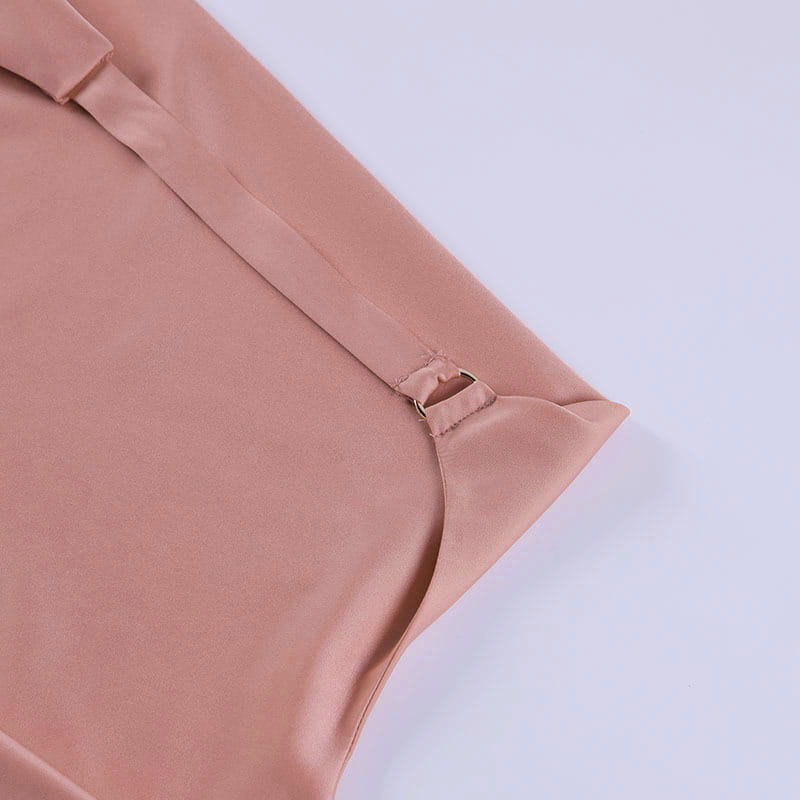A soft blush pink satin halter mini party dress featuring a sleeveless top with a sleek smooth texture and subtle sheen.