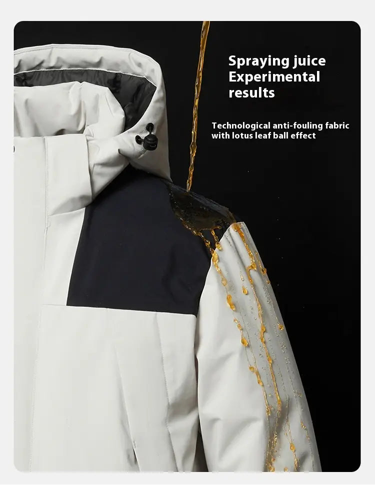 White and navy blue windproof waterproof puffer jacket made with lotus leaf-inspired anti-fouling fabric that repels liquid.