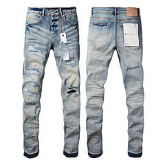 Men’s distressed slim fit patchwork denim jeans in light-wash denim with ripped details and a slim-fit cut.