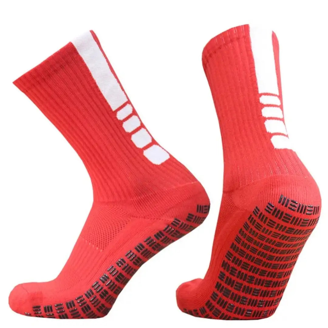 Bright red grip soccer socks with white stripes on the side and black textured non slip soles designed for athletic use.