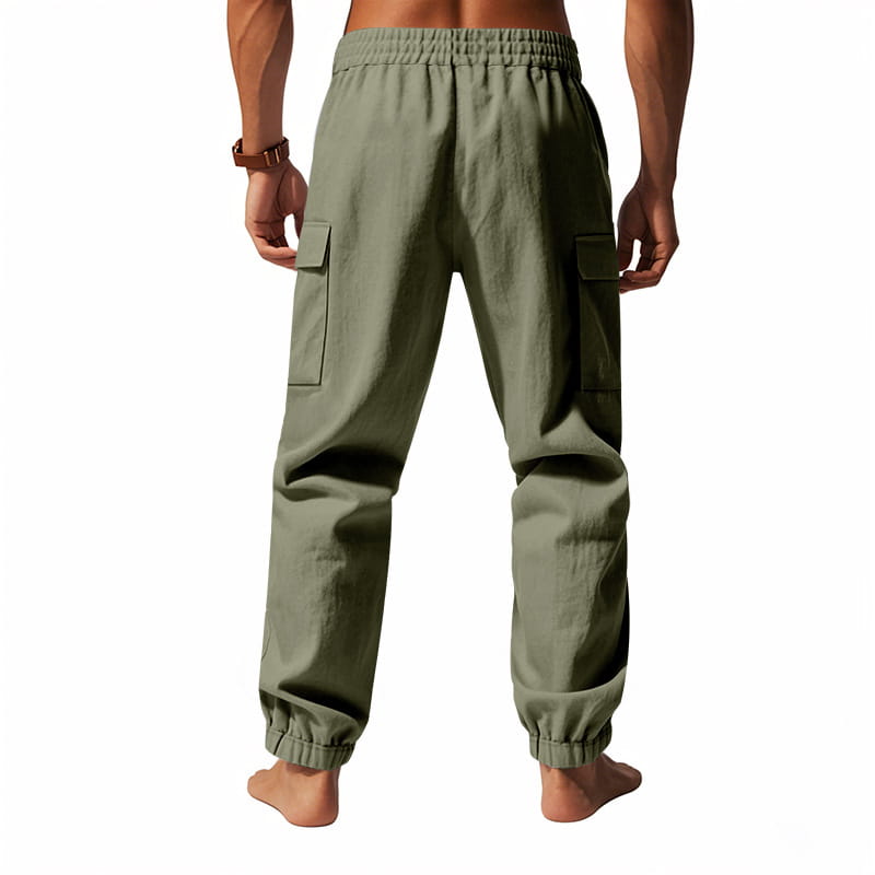 Men linen cargo pants in olive green featuring an elastic waistband and drawstring cuffs at the ankle.