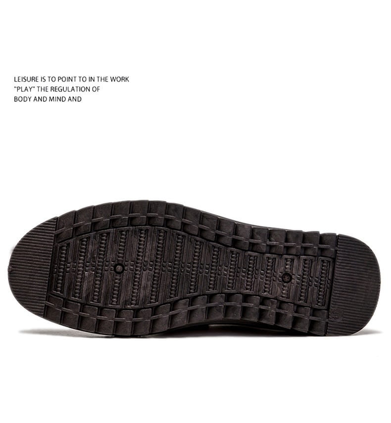 Men’s lightweight breathable white faux leather slip on shoe with brown embroidered detailing and textured rubber sole