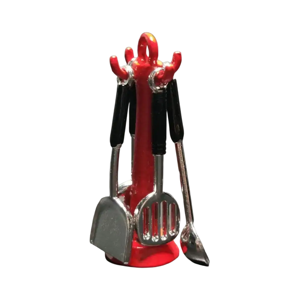 Red plastic kitchen utensil holder with black handles containing silver miniature metal kitchen tools in 1 12 set