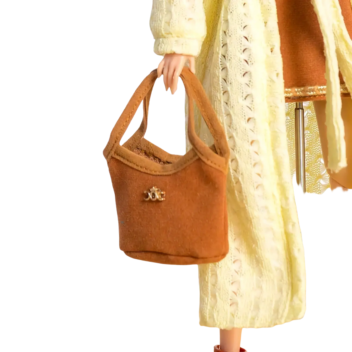 A tan suede miniature handbag with a gold-toned clasp for 1/6 doll handbag and hat fashion accessories