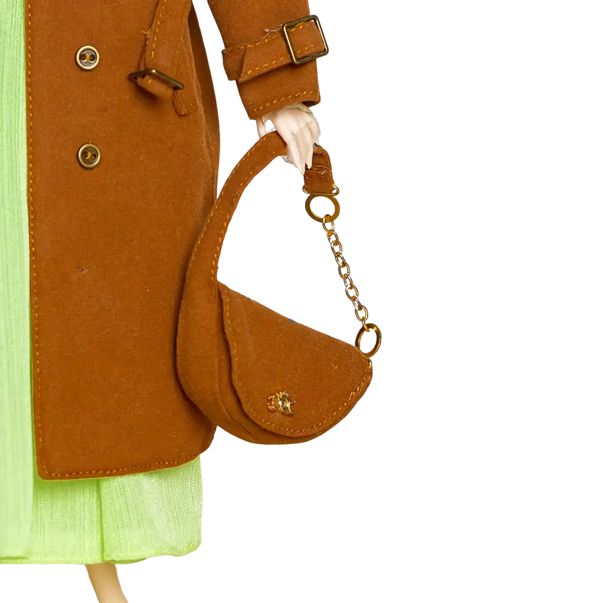 A tan suede 1/6 doll mini handbag with a gold chain strap and a small metallic logo on the front