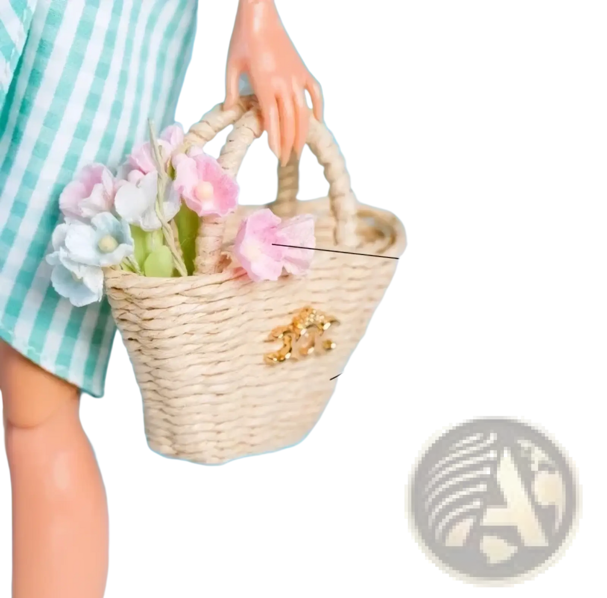 A beige woven straw tote bag with a gold-tone clasp holding pink and white paper flowers for 1/6 scale dolls