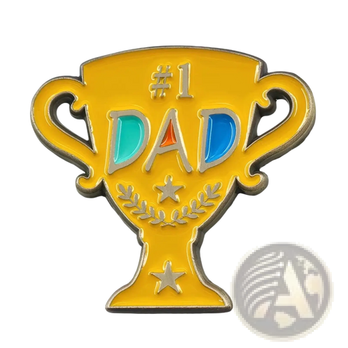 A shiny gold #1 dad trophy enamel pin with silver lettering and teal blue accents on a golden brooch