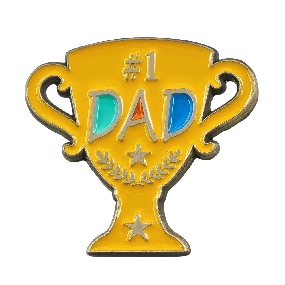A shiny gold #1 dad trophy enamel pin with silver lettering and teal blue accents on a golden brooch
