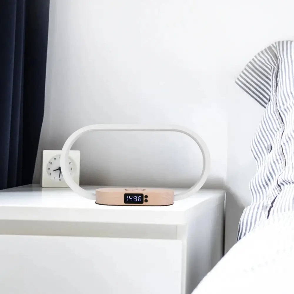 Minimalist oval wireless charging touch lamp with digital clock featuring beige base and white translucent frame