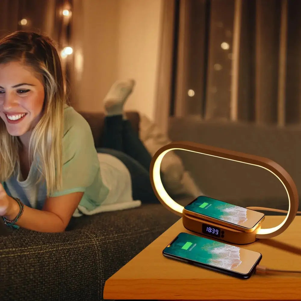 Golden oval wireless charging nightstand with integrated led light ring and digital clock display for bedroom use