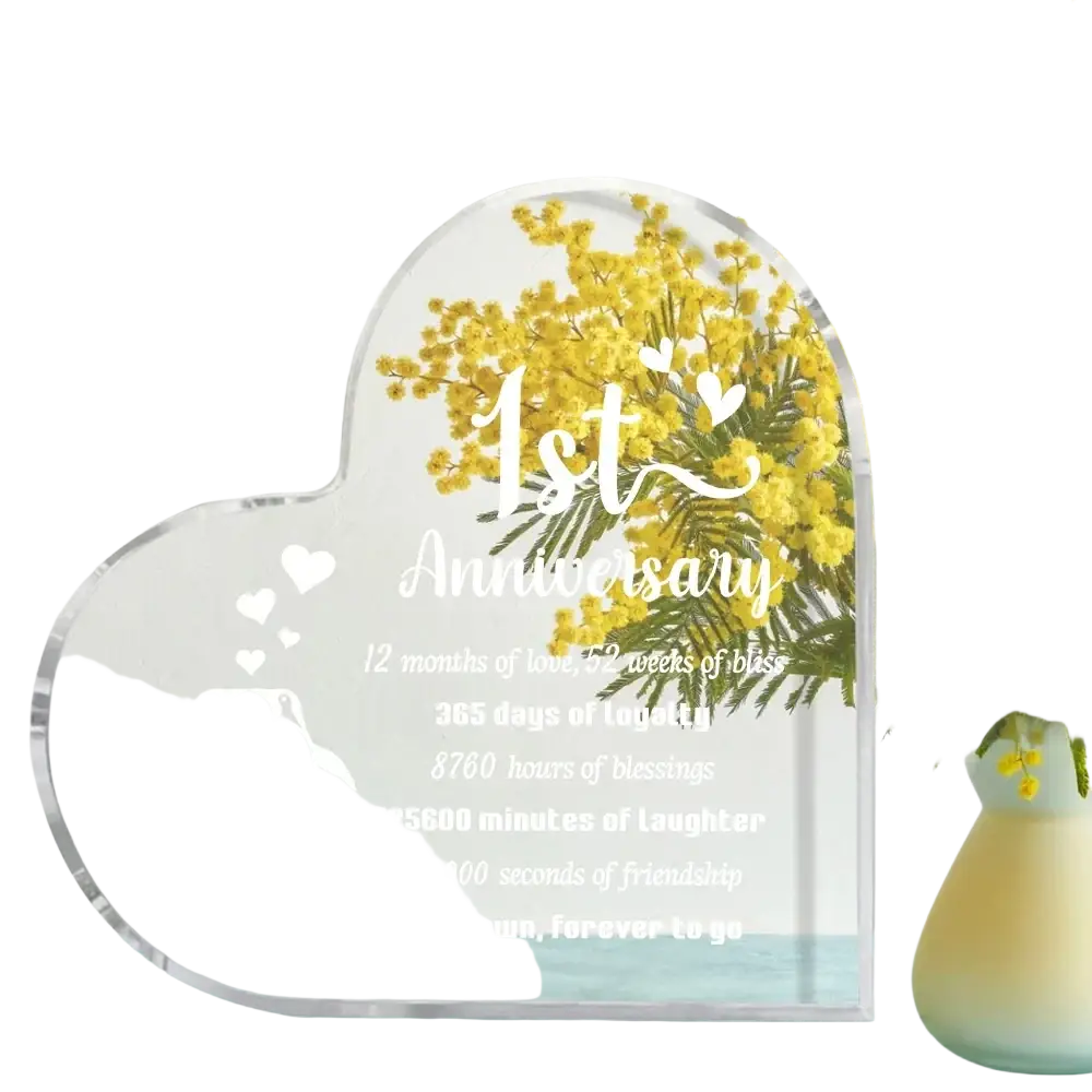 Clear acrylic heart-shaped 1 year anniversary plaque with engraved penguin design and personalized text