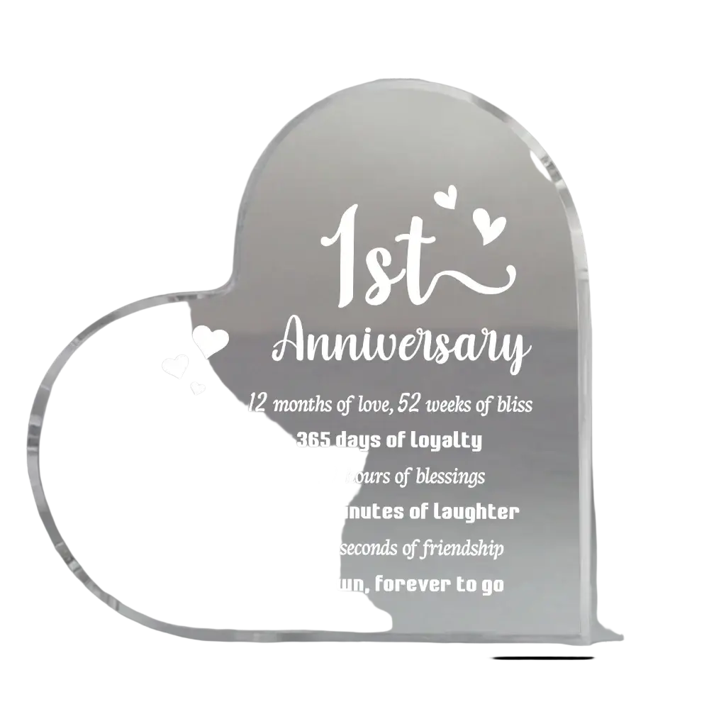 Clear heart-shaped acrylic plaque with engraved white text and penguin design for 1 year anniversary celebration