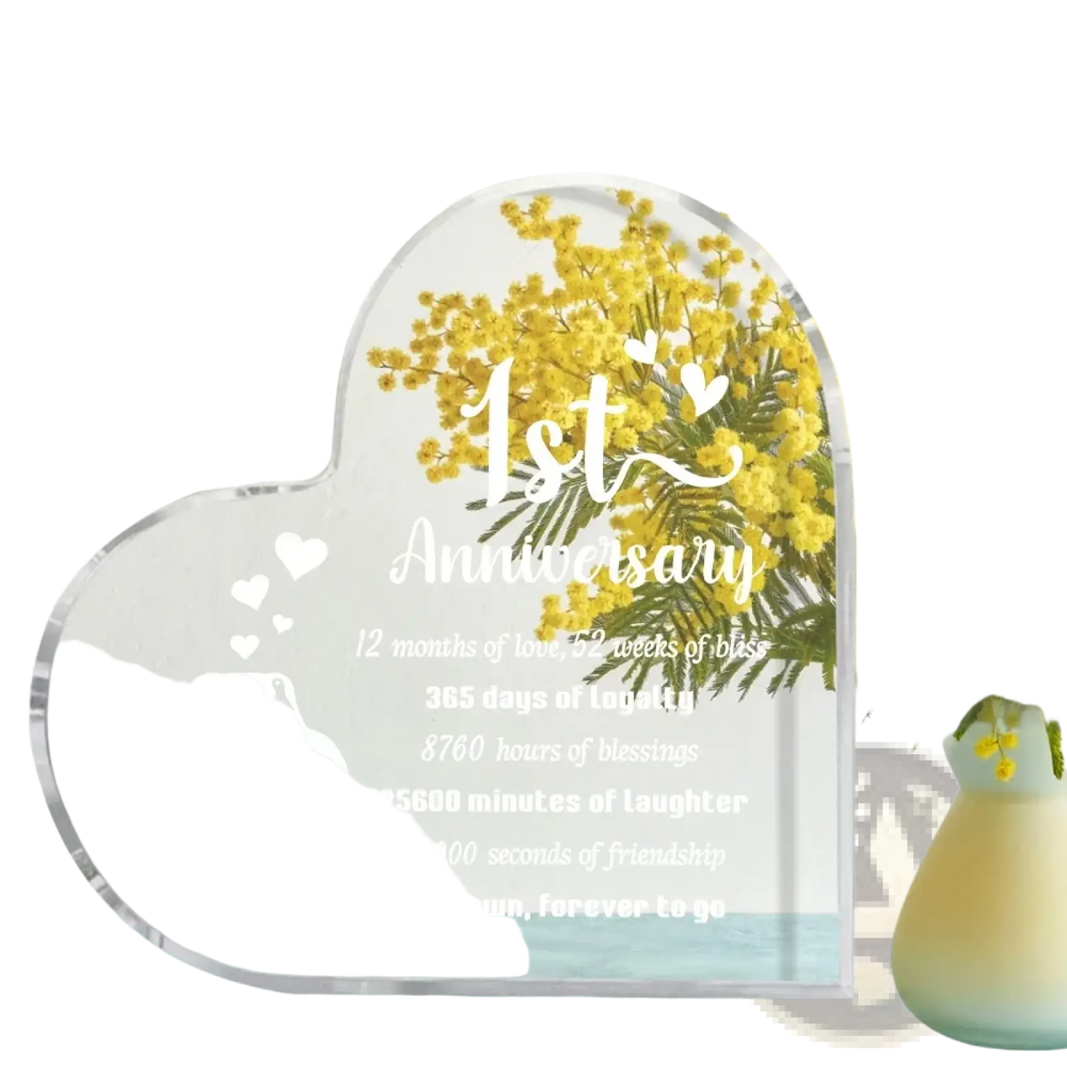 Clear acrylic heart-shaped 1 year anniversary plaque with engraved penguin design and personalized text