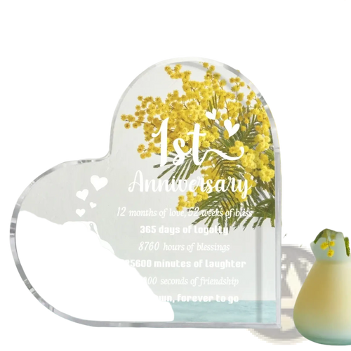Clear acrylic heart-shaped 1 year anniversary plaque with engraved penguin design and personalized text