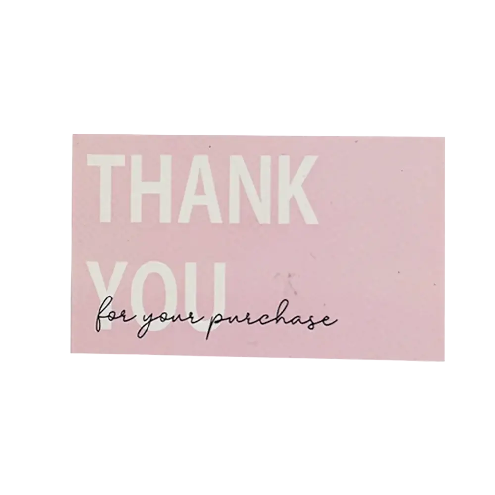 A soft pink rectangular thank you card with bold white uppercase letters and delicate black cursive script for small business use
