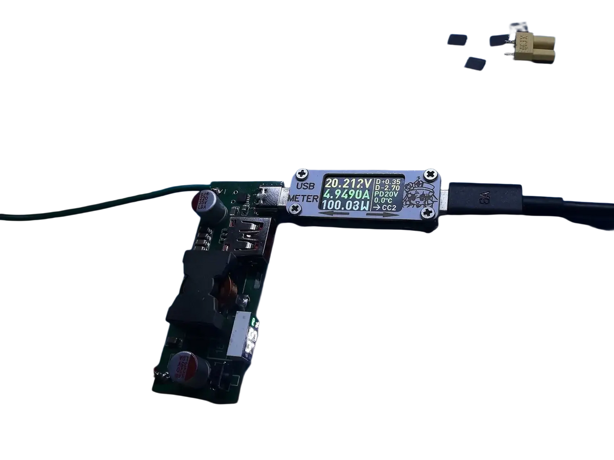 Black usb power meter with green digital display showing voltage and current for 100w pd3.1 fast charger power bank module bms