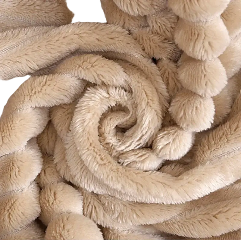 Beige 100x150cm fleece throw blanket with soft plush texture and spiral pom-pom accents for bed or sofa use