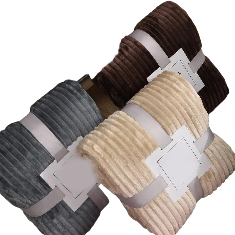 Stacked fleece throw blankets 100x150cm in soft gray beige and brown corduroy with ribbed texture and satin ribbon ties