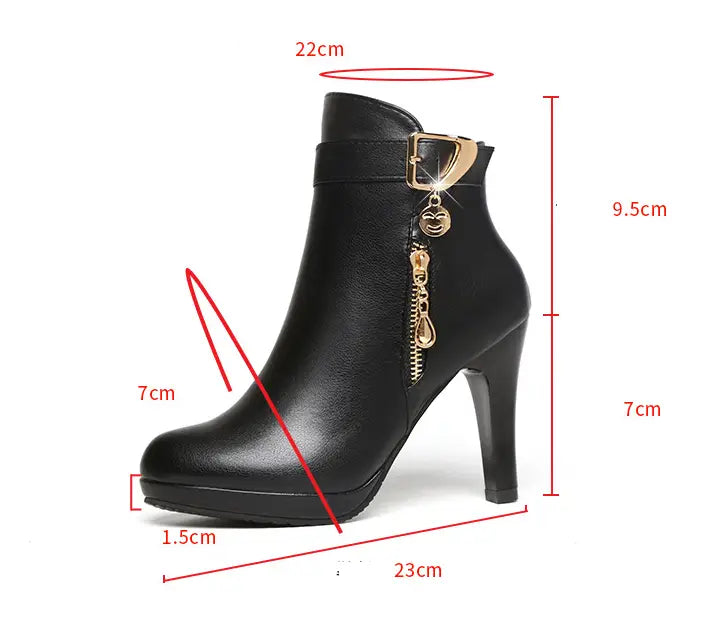Black leather ankle boot with gold-tone buckle and zipper featuring a high heel and platform sole.