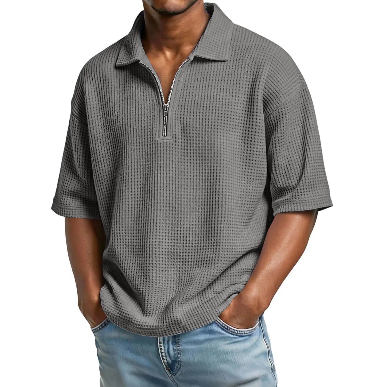 Gray waffle-knit men’s polo shirt with half-zip front and short sleeves made from breathable material.