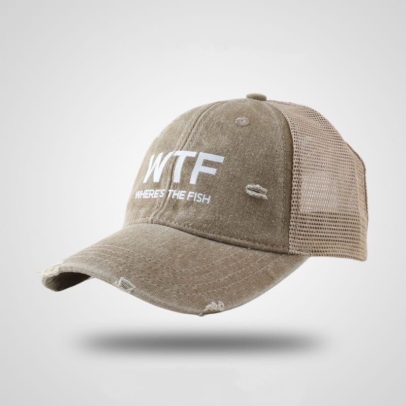 A distressed beige fishing trucker hat with an embroidered mesh back and white text reading wtf where’s the fish.