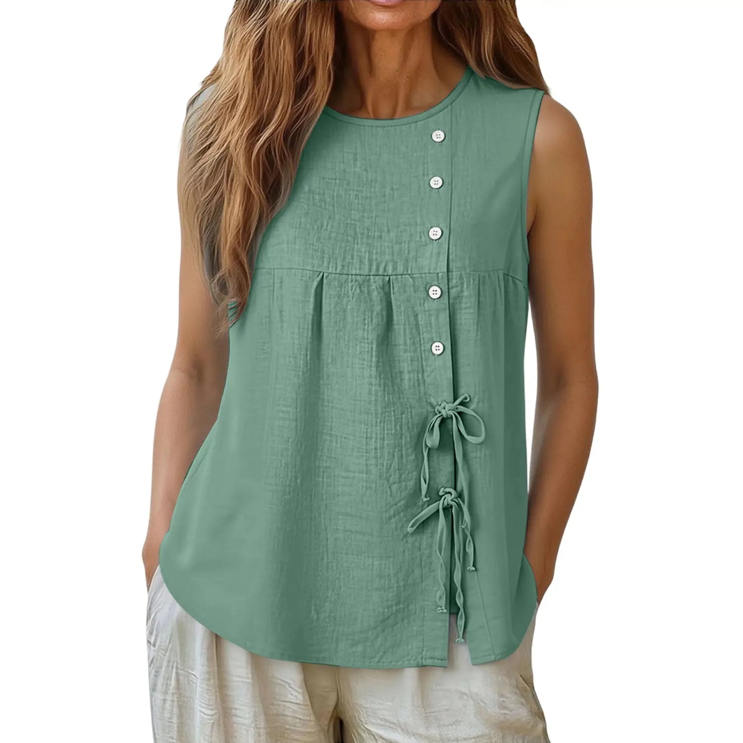 A soft sage green sleeveless tie side button down blouse featuring a button front and tied cord details.