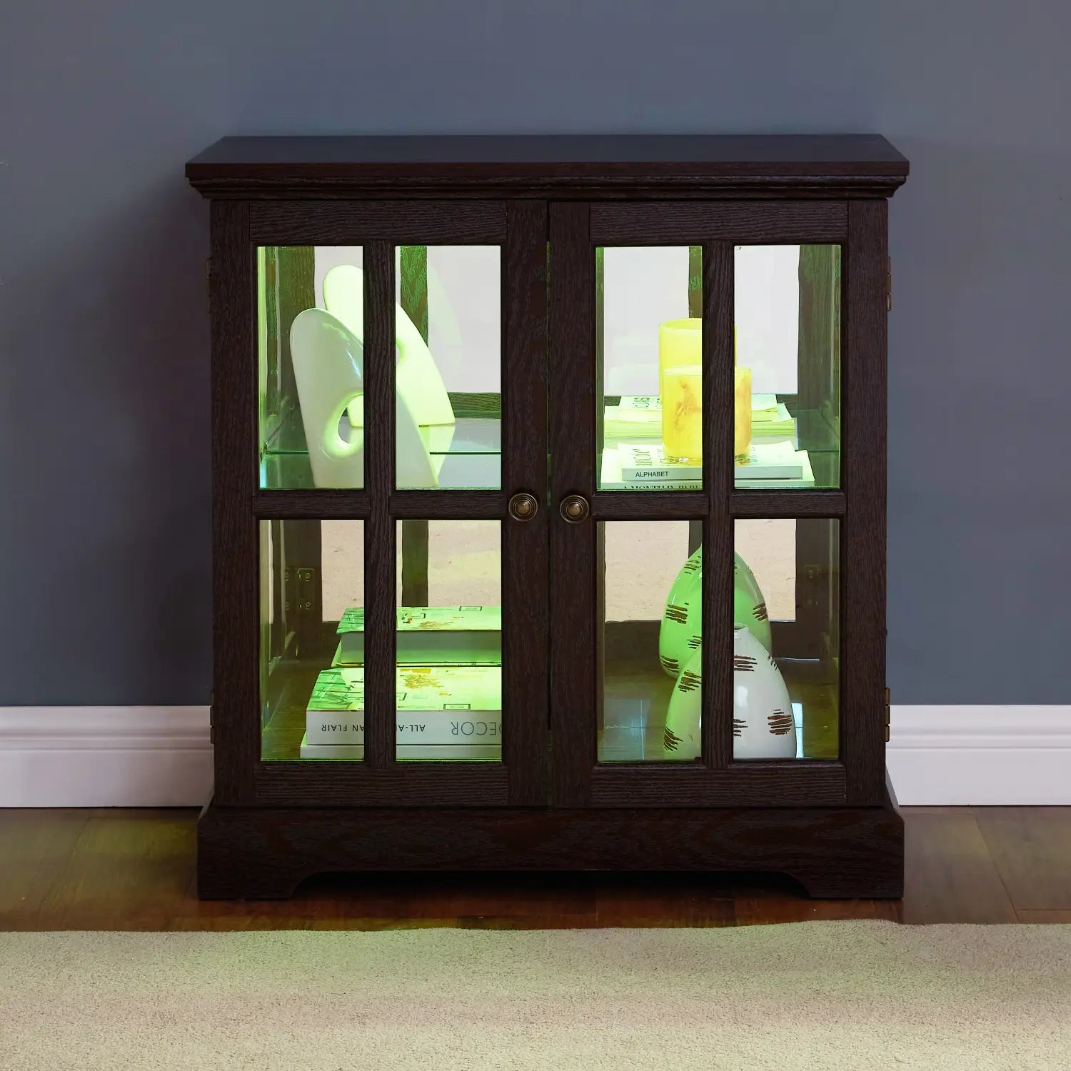 dark wood two-door led curio display cabinet with glass panels, brass hardware, and adjustable shelves for elegant home decor.