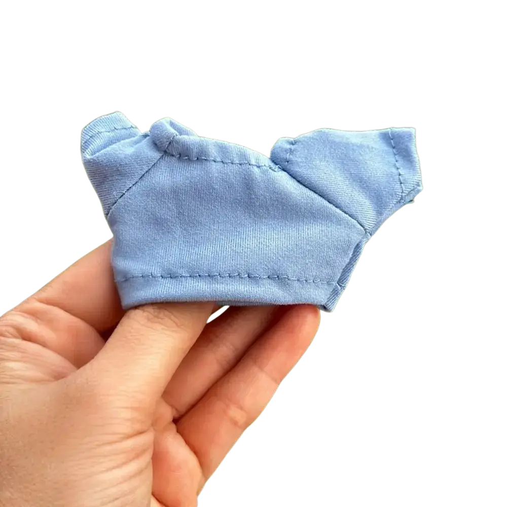 A light blue soft cotton 10cm doll hoodie and t-shirt with short sleeves and simple stitched design