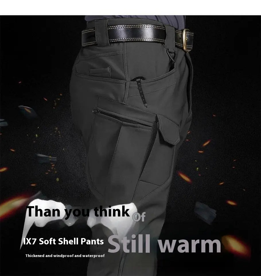 Men’s fleece-lined waterproof tactical dark gray ix7 soft shell pants with multiple cargo pockets and reinforced belt loop design.