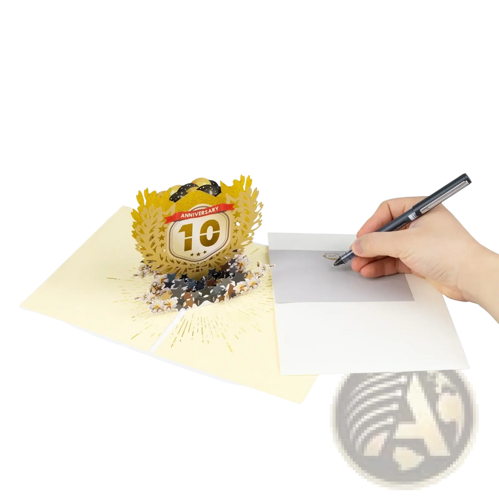 Golden 3d pop up card featuring a 10th anniversary emblem with laurel wreath and sparkling embellishments