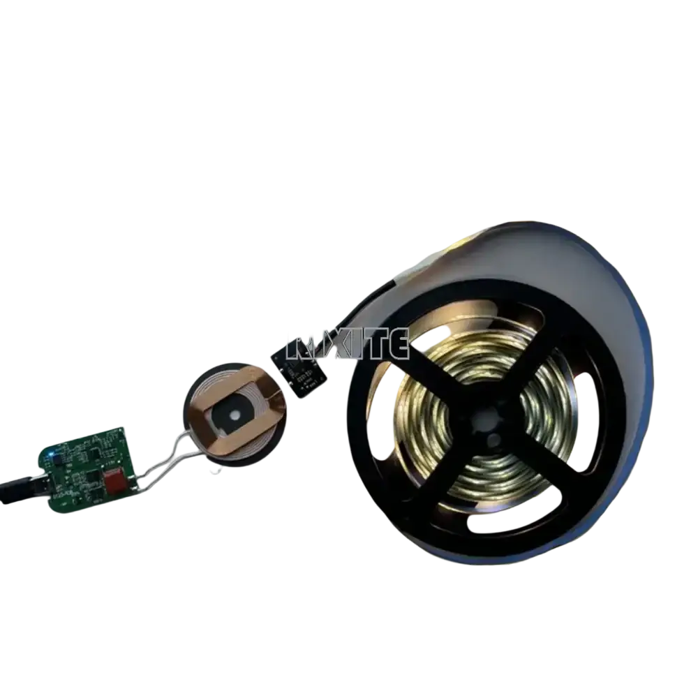 A coiled led strip light with gold wiring on a black and silver spool for 10w wireless charging diy module
