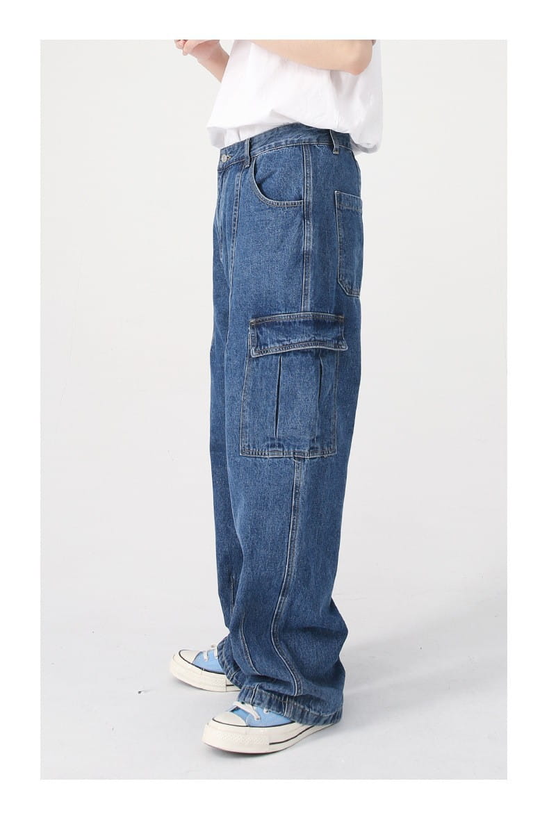 Blue denim cargo pants feature multiple pockets and a relaxed wide-leg fit in a retro loose fit design.