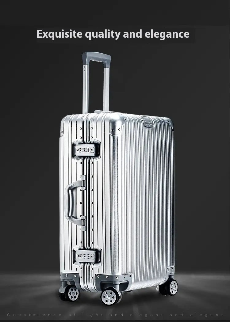 Silver aluminum magnesium luggage hardshell spinner suitcase with vertical ribbed design and four spinner wheels.
