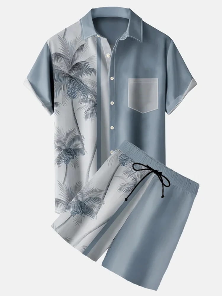 Light blue men’s tropical print short sleeve shirt with palm tree design on one side and solid color on the other, paired with matching shorts.