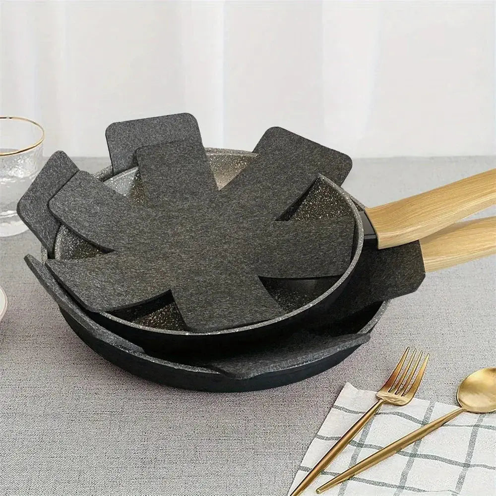 Black felt frying pan protector with star-shaped design and wooden handle for stacking pots and pans