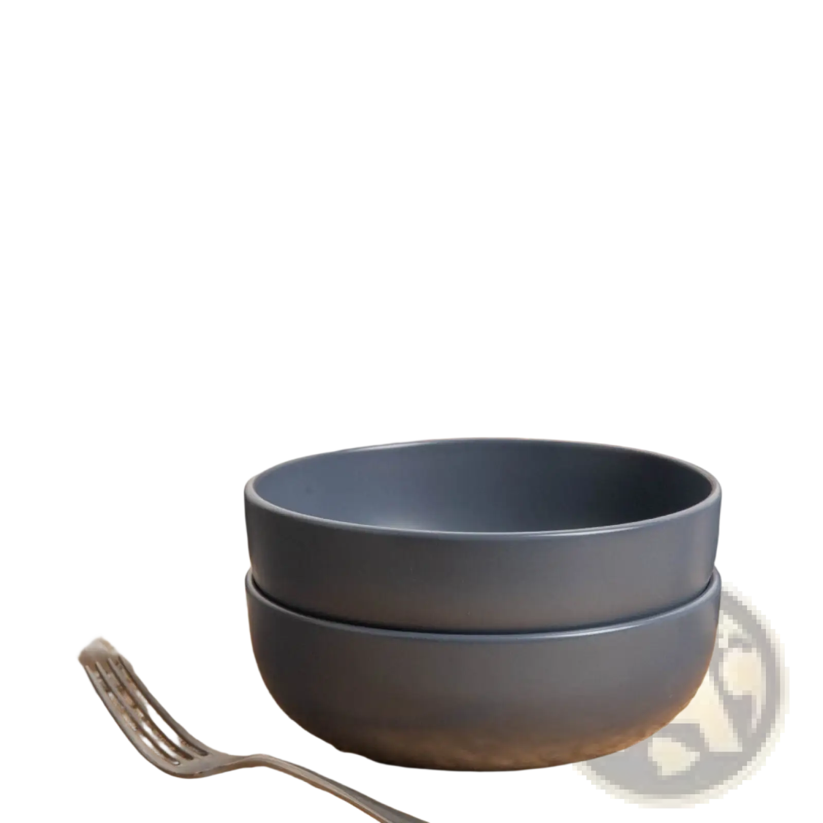 Stacked matte gray ceramic bowls from a 12-piece stoneware dinnerware set with matte glaze for service for 3