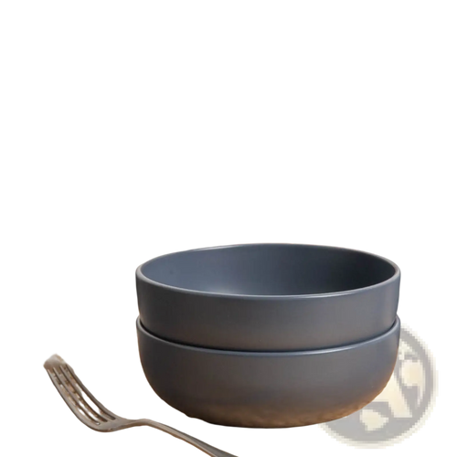 Stacked matte gray ceramic bowls from a 12-piece stoneware dinnerware set with matte glaze for service for 3