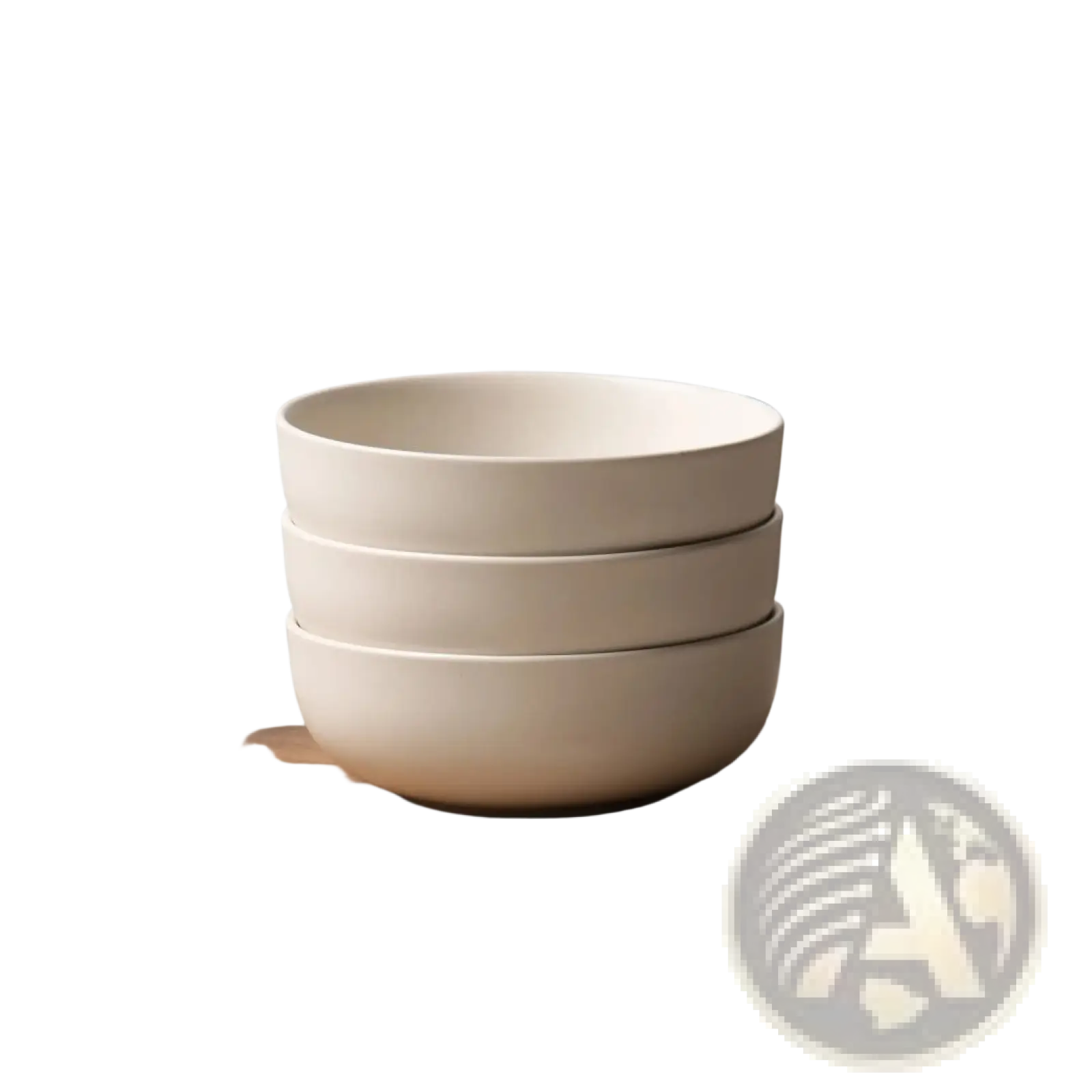 Stack of three off-white ceramic bowls with smooth rounded edges from a 12 piece stoneware dinnerware set with mugs for 3