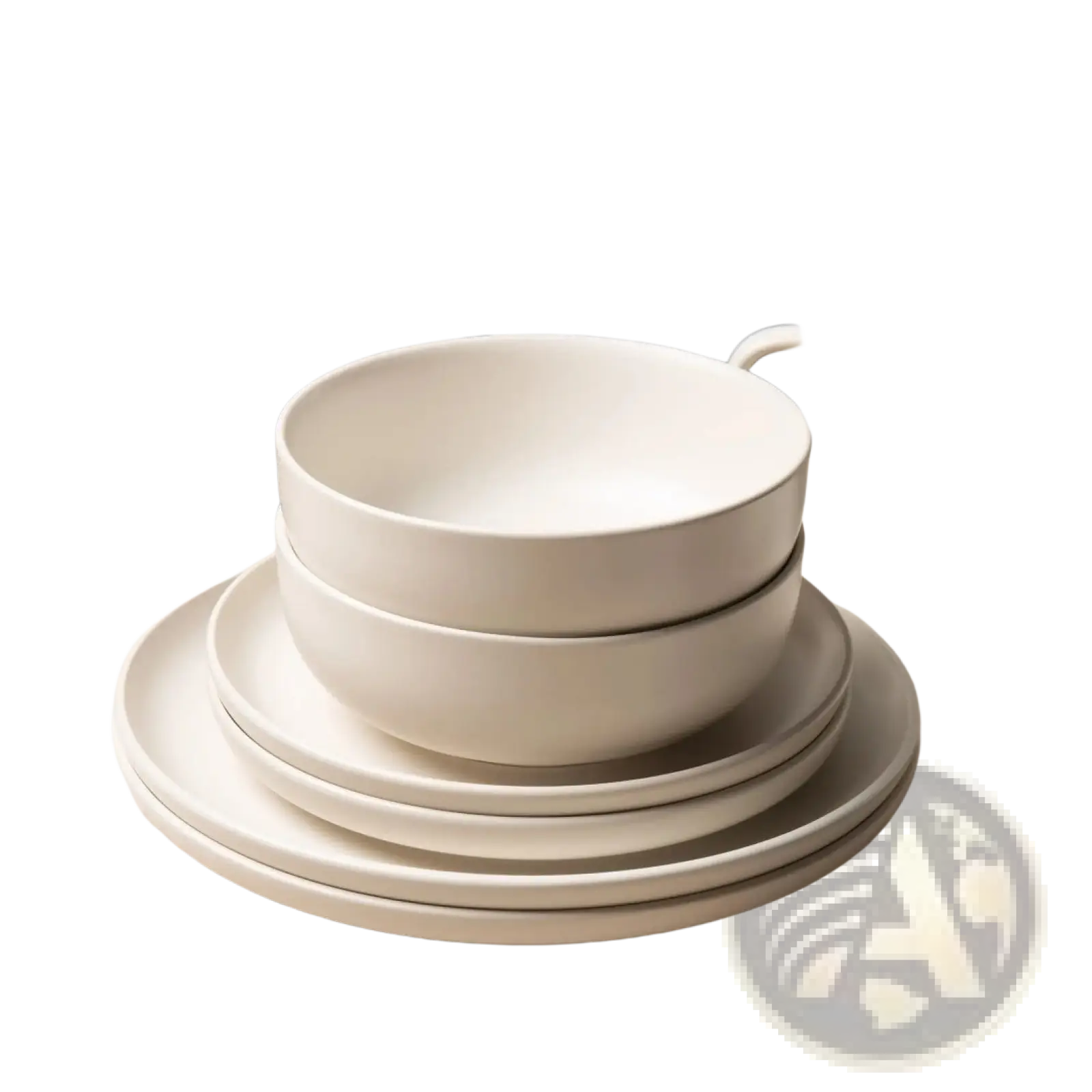 Stack of minimalist white ceramic bowls with a smooth matte finish from a 12 piece stoneware dinnerware set with mugs