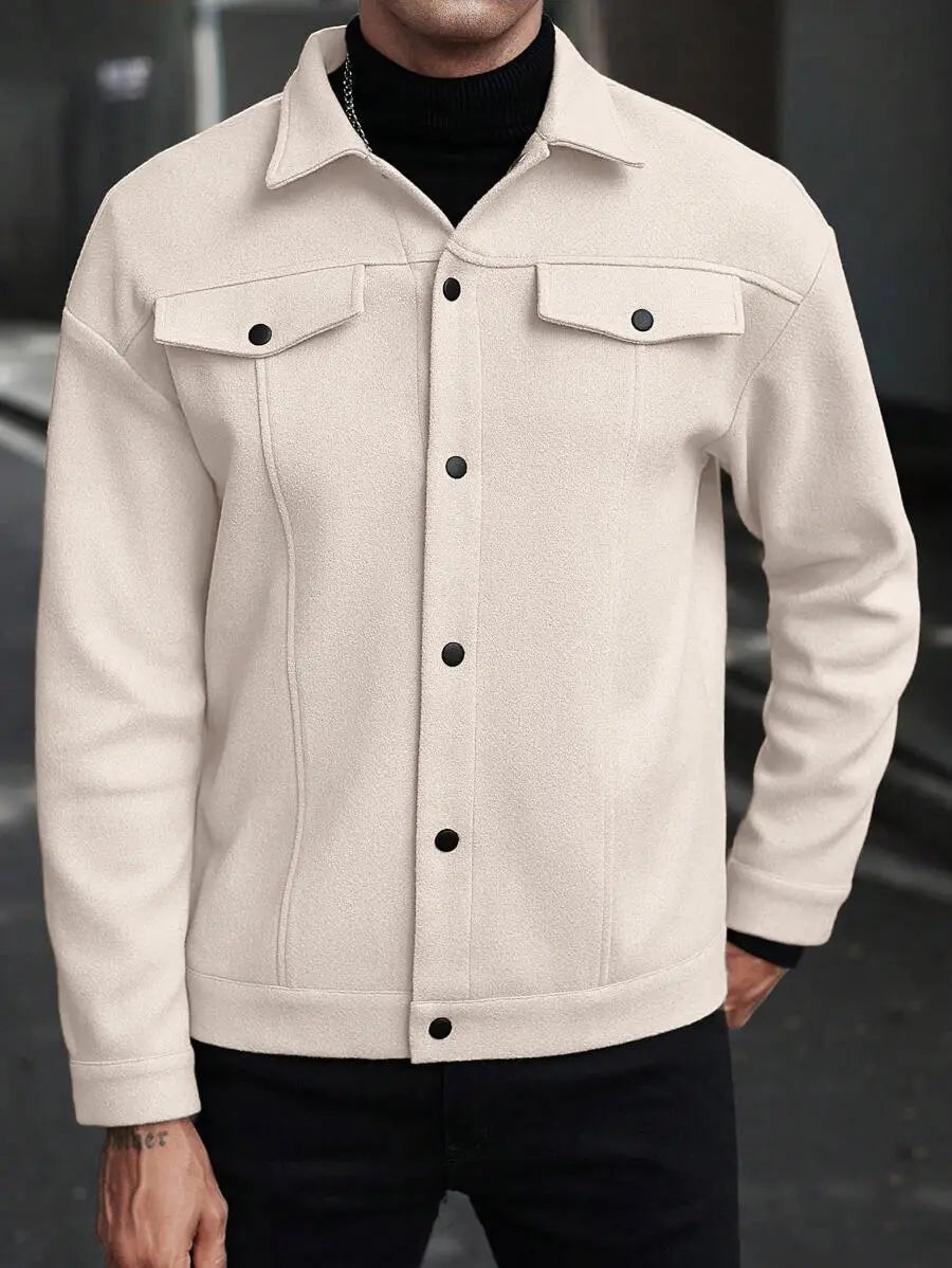 Men’s classic slim fit wool blend lapel jacket in cream color with black button closures and flap pockets.