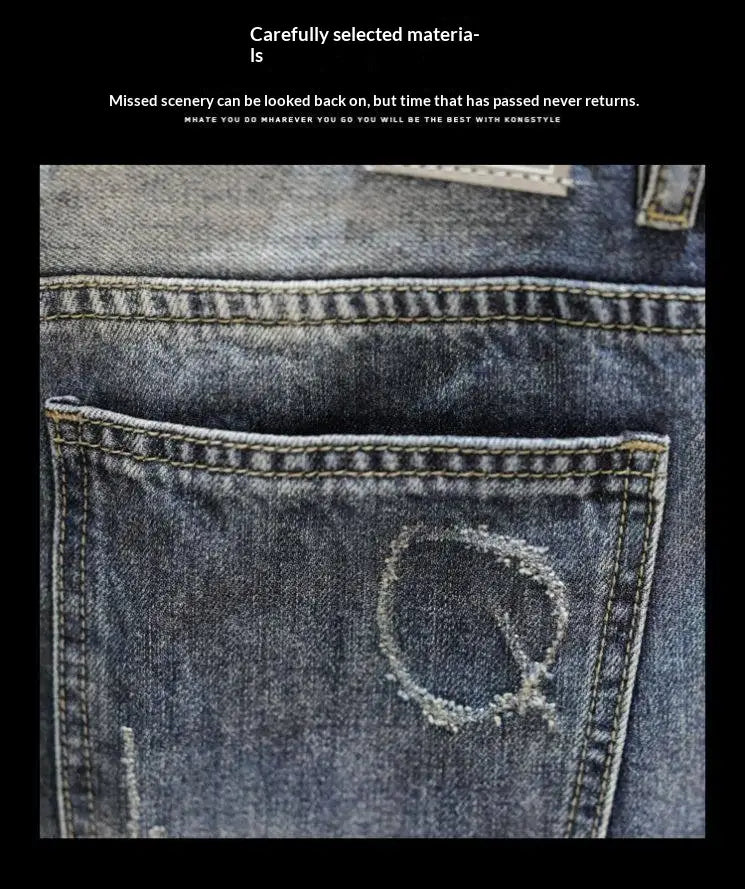 back pocket of distressed maple leaf denim shorts in blue showing a faded circular patch of frayed fabric on the denim material