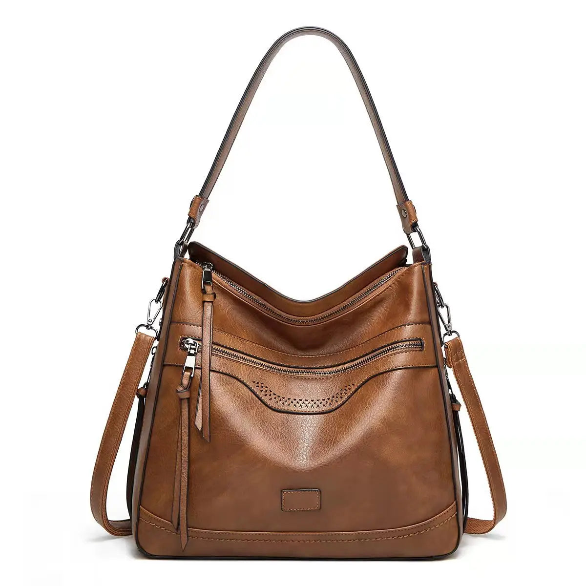 Vintage-Ledertasche im Totebag-Stil in Braun mit mehreren Reißverschlüssen, dekorativen perforierten Details, einem einzelnen Tragegriff sowie einem abnehmbaren Crossbody-Riemen.