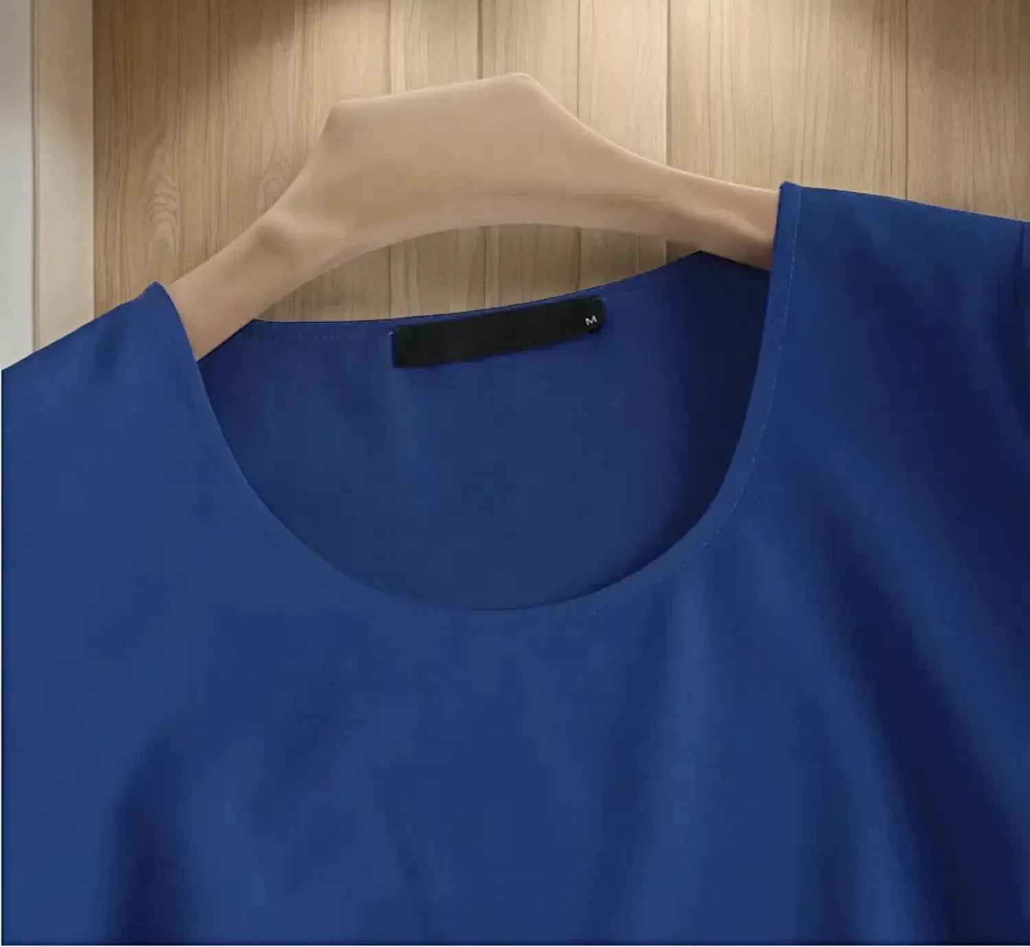 A vibrant royal blue plus size chiffon layered top featuring a sleeveless design with soft smooth fabric and a rounded neckline.