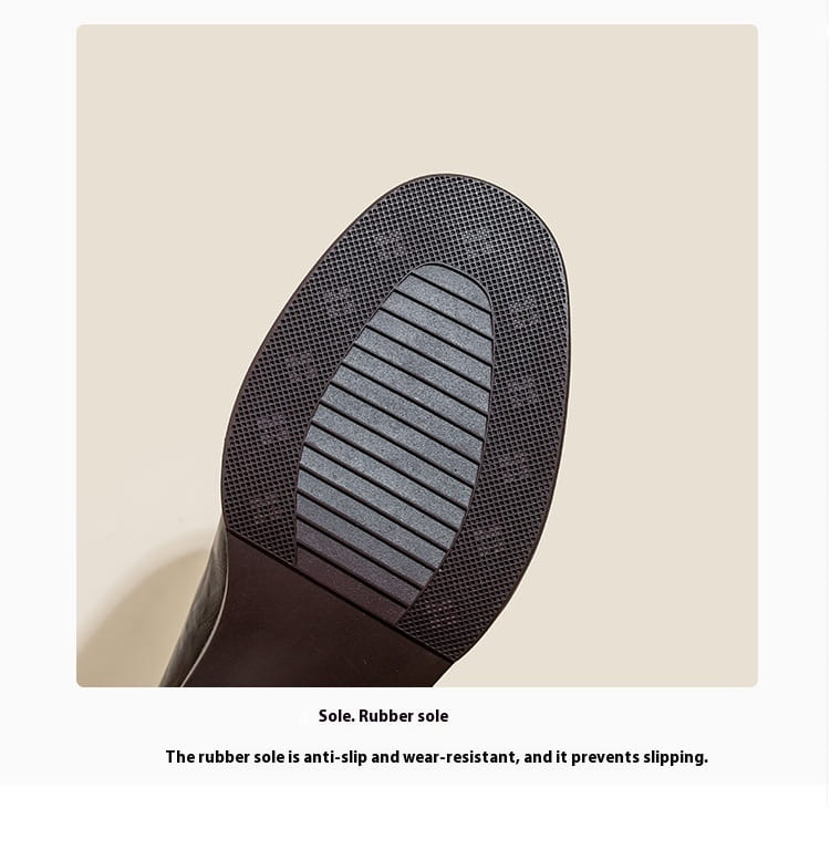 black leather mary jane shoes with block heel showing the black rubber sole with textured anti-slip tread pattern