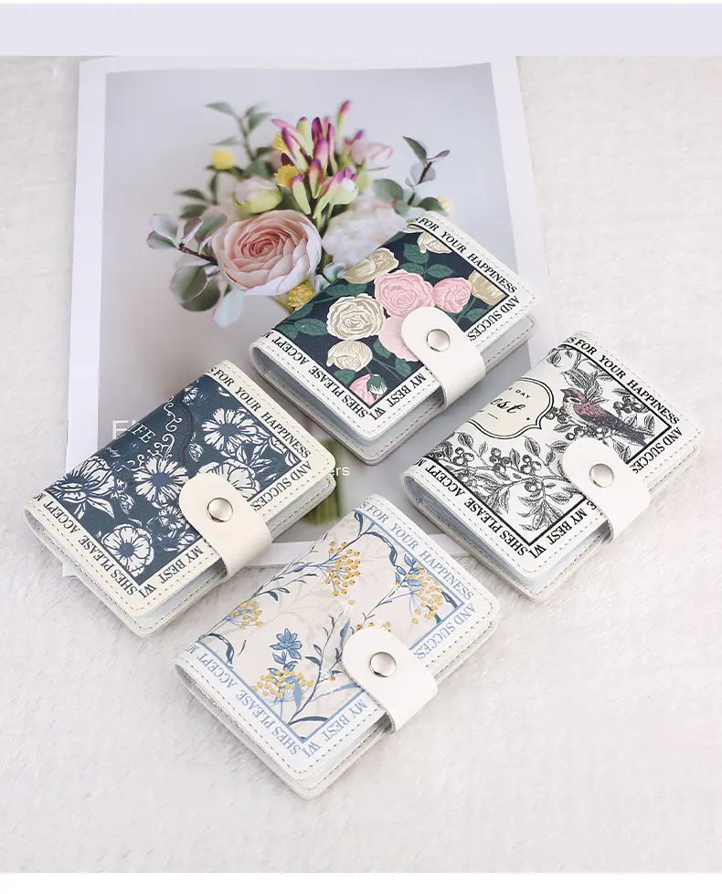 four vintage floral pu leather multi slot card holder wallets in assorted colors with floral patterns each featuring a white leather strap and silver-toned snap closure