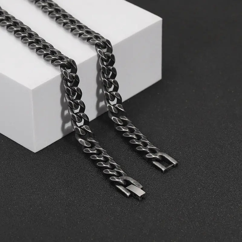 matte black stainless steel curb chain bracelet featuring a matte finish and sturdy interlocking links